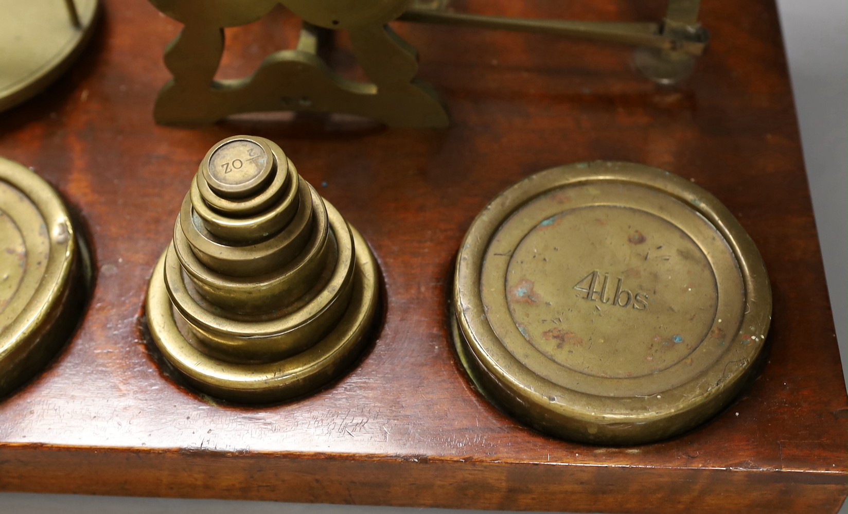 Victorian brass postal scales by S. Mordan & Co. of London, on a mahogany plinth, 45cm wide